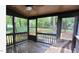 Inviting screened porch offers wooded views and a peaceful spot to relax at 4812 Latimer Rd, Raleigh, NC 27609