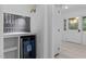 Wet bar with beverage fridge and tiled backsplash at 4812 Latimer Rd, Raleigh, NC 27609