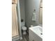Bathroom featuring shower with glass doors, modern vanity, fixtures and neutral paint at 500 John St St, Clayton, NC 27520