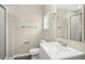 Modern bathroom with a white vanity, sleek mirror, and shower, offering functionality and style at 500 John St St, Clayton, NC 27520