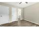 Bedroom with wood flooring, a view to the bathroom, and white doors, creating a tranquil retreat at 500 John St St, Clayton, NC 27520