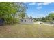 Exterior shot of a gray home with well-maintained grassy yard on a sunny day at 500 John St St, Clayton, NC 27520