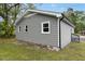 Exterior view of home with gray siding, white trim, and a well-maintained lawn at 500 John St St, Clayton, NC 27520