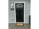 Inviting front entrance featuring a black door with a decorative window and a 'Welcome' mat at 500 John St St, Clayton, NC 27520