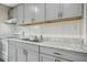Well-lit kitchen featuring stainless steel appliances, white subway tile backsplash, and granite countertops at 500 John St St, Clayton, NC 27520