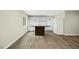 Charming kitchen with white cabinetry, modern appliances, and an island at 500 John St St, Clayton, NC 27520