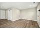 Open living area with vinyl floors and multiple doors, creating a bright and airy feel at 500 John St St, Clayton, NC 27520