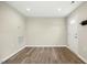 Spacious living room featuring neutral walls and modern vinyl floors, perfect for entertaining at 500 John St St, Clayton, NC 27520