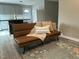 Cozy living room area with modern futon, stylish rug, and light, neutral walls at 500 John St St, Clayton, NC 27520