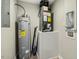 Utility room with a water heater, HVAC system, and laundry hookups, offering convenience at 500 John St St, Clayton, NC 27520