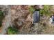 Aerial of the house with large trees, roof, and road nearby at 505 E Graham St, Mebane, NC 27302