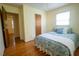 Comfortable bedroom featuring hardwood floors, natural light, and neutral paint at 505 E Graham St, Mebane, NC 27302