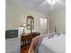 Cozy bedroom with hardwood floors, desk, and natural light from the window at 505 E Graham St, Mebane, NC 27302