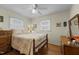 Bright bedroom with hardwood floors, natural light, and a cozy double bed at 505 E Graham St, Mebane, NC 27302
