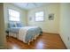 Light-filled bedroom with hardwood floors and serene decor at 505 E Graham St, Mebane, NC 27302