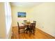 Bright dining area featuring hardwood floors, a window with natural light, and a four-chair dining set at 505 E Graham St, Mebane, NC 27302