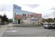 Historical Five Star Building mural featuring colorful graphics, art, and street parking at 505 E Graham St, Mebane, NC 27302