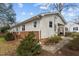Rear view of a house showing the brick foundation and partial covered parking at 505 E Graham St, Mebane, NC 27302
