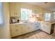 Cozy kitchen with ample counter space, white appliances and a window overlooking the outdoors at 505 E Graham St, Mebane, NC 27302