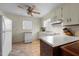 Bright kitchen includes laminate countertops, neutral flooring, and a breakfast bar at 505 E Graham St, Mebane, NC 27302