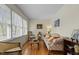 Inviting living room with hardwood floors, bright window, and comfortable seating arrangement at 505 E Graham St, Mebane, NC 27302