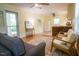 Inviting living room featuring hardwood floors, neutral walls, and cozy furniture, seamlessly connecting to the kitchen area at 505 E Graham St, Mebane, NC 27302