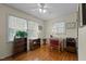 Bright home office with hardwood floors, a ceiling fan, and ample natural light at 505 E Graham St, Mebane, NC 27302