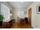 Home office with hardwood floors, natural light, and a functional workspace at 505 E Graham St, Mebane, NC 27302