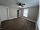 Bedroom features neutral carpet, ceiling fan, and a closet at 5116 Nc 56 Hwy, Franklinton, NC 27525