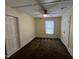 Bedroom featuring neutral walls, carpet flooring, closet, and a ceiling fan at 5116 Nc 56 Hwy, Franklinton, NC 27525