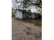 A gray house with white trim is viewed from the side with a gravel driveway at 5116 Nc 56 Hwy, Franklinton, NC 27525