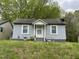 Charming one-story home featuring a cozy entrance and a well-maintained front lawn at 5116 Nc 56 Hwy, Franklinton, NC 27525