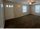 Cozy living room featuring neutral carpet, blinds, and a ceiling fan at 5116 Nc 56 Hwy, Franklinton, NC 27525