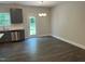 Dining area with wood floors, modern chandelier, and a view of the backyard at 540 Eversden Dr, Zebulon, NC 27597