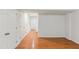Basement features hardwood floors, and white-painted walls with plenty of storage space at 5507 Vista View Ct, Raleigh, NC 27612