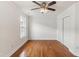Bedroom with hardwood flooring, ceiling fan, and a window that offers natural light at 5507 Vista View Ct, Raleigh, NC 27612