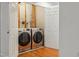 Laundry room with modern, front-load washer and dryer for efficient laundry management at 5507 Vista View Ct, Raleigh, NC 27612