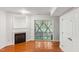 Cozy living room with fireplace, sliding glass doors, and hardwood floors throughout at 5507 Vista View Ct, Raleigh, NC 27612