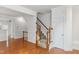 Living room features hardwood floors, decorative molding, and a staircase leading to the second floor at 5507 Vista View Ct, Raleigh, NC 27612