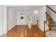 This living room features hardwood floors and decorative molding and is conveniently located near the stairway at 5507 Vista View Ct, Raleigh, NC 27612