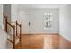 Bright living room features hardwood floors, a window, and neutral paint throughout at 5507 Vista View Ct, Raleigh, NC 27612