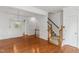 The living room features hardwood floors, decorative molding, and a staircase leading to the second floor at 5507 Vista View Ct, Raleigh, NC 27612