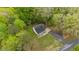 Charming home nestled in a lush, green landscape with a private driveway and mature trees at 5541 Old Still Rd, Wake Forest, NC 27587