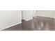 Finished basement with dark wood-look flooring; ample space for recreation and storage at 5541 Old Still Rd, Wake Forest, NC 27587
