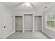 Bedroom with three closets, a ceiling fan, and a window with natural light at 5541 Old Still Rd, Wake Forest, NC 27587