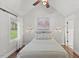 Vaulted bedroom featuring a decorative painting above the bed and hardwood floors at 5541 Old Still Rd, Wake Forest, NC 27587