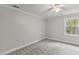 Bedroom featuring neutral colors, gray carpet and a window with natural light at 5541 Old Still Rd, Wake Forest, NC 27587