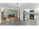 Open concept kitchen with stainless steel appliances and a view of the living room at 5541 Old Still Rd, Wake Forest, NC 27587