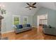 Comfortable living room with hardwood floors and a view to the home's entryway and outdoor scenery at 5541 Old Still Rd, Wake Forest, NC 27587
