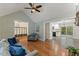 Living room view to entry way, stairs, and kitchen with seamless flow and natural light at 5541 Old Still Rd, Wake Forest, NC 27587
